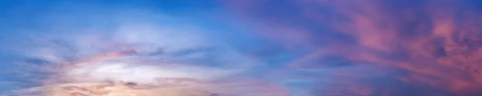 Dramatic panorama sky with cloud on sunrise and sunset time. Stock Photos