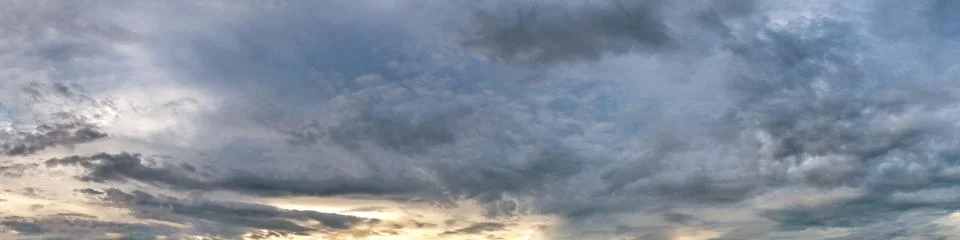 Dramatic panorama sky with storm cloud on a cloudy day. Stock Photos