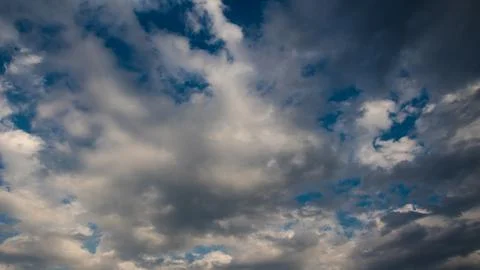 Dramatic panorama with white clouds and blue sky Stock Photos