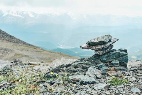 Dramatic panoramic landscape of rocky mountains among storm clouds Stock Photos