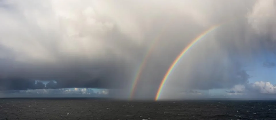 Dramatic Panoramic View of a cloudscape with Rainbow Foto stock