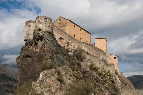 Dramatic panoramic view of the Conte Corsica citadel perched high on hilltop Stock Photos