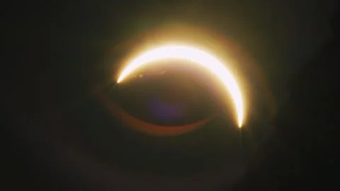 Dramatic Partial Solar Eclipse with Glowing Crescent Sun Stock Footage 344012468