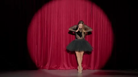 Dramatic performance, beautiful ballerina in a black tutu perform dramatic dance Stock Footage 287288210