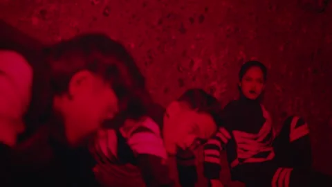 Dramatic Performance in Red Lighting Stock Footage 296679494