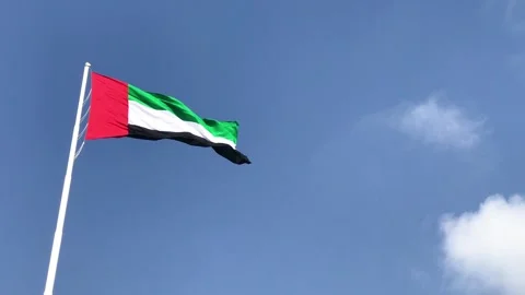 Dramatic perspective of Emirates flag fluttering high in the wind with deep.. Stock Footage 332117372