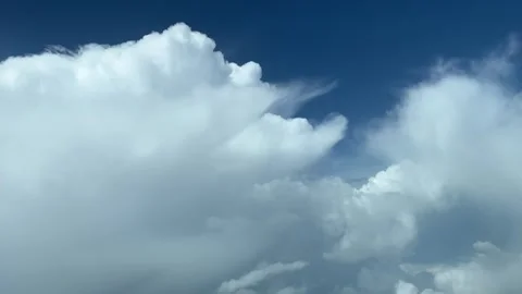 A dramatic pilot’s perspective looking for a gap to cross some stormy Stock Footage 242396720