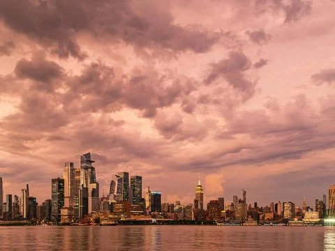 Dramatic Pink Sky after Storm, Midtown New York City at Sunset Stock Photos