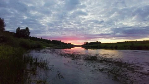 Dramatic pink sunset on the river Stock Footage 159593568