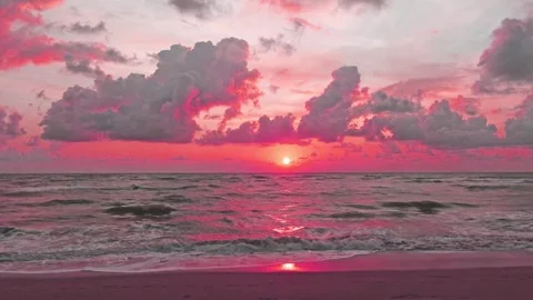 Dramatic pink sunset sky n dark cloud over tropical summer beach Stock Footage 310738633