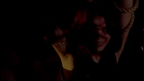 Dramatic Portrait of a Bound Woman in Shadows Stock Footage 294192894