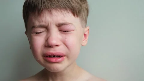 Dramatic portrait of a crying 7 year old... | Stock Video | Pond5