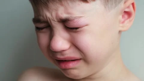 Dramatic portrait of a crying 7 year old... | Stock Video | Pond5