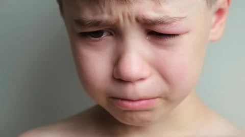Dramatic portrait of a crying 7 year old... | Stock Video | Pond5
