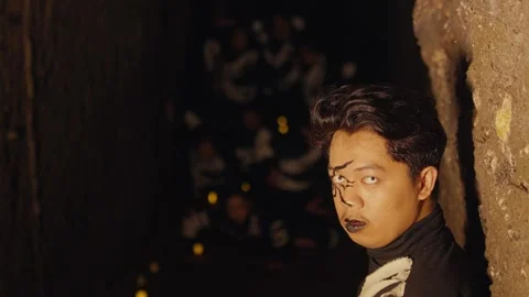 Dramatic Portrait in a Dimly Lit Tunnel Stock Footage 296680476