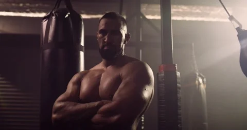 A Dramatic Portrait Of A Heavyweight Hispanic Bodybuilder / Weightlifter Stock Footage 158434814