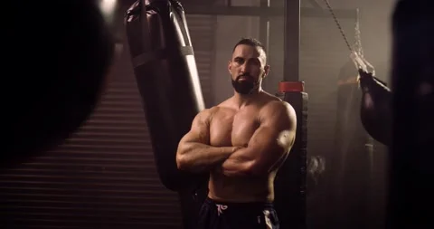 A Dramatic Portrait Of A Heavyweight Hispanic Bodybuilder / Weightlifter Stock Footage 158435346