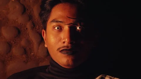 Dramatic Portrait of a Man with Striking Makeup Stock Footage 296680816