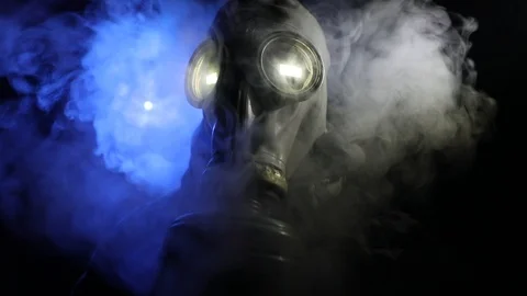 Dramatic portrait of a man wearing a gas mask 스톡 동영상 126883740
