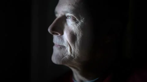 Dramatic portrait of a mature man in a low light looking at camera. Stock Footage 148109506