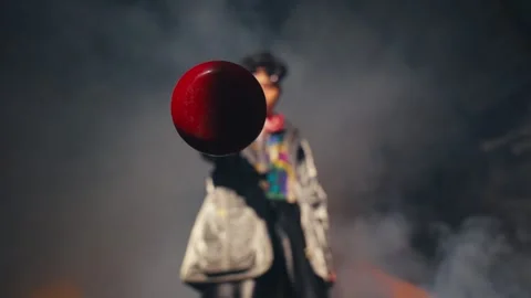 Dramatic Portrait of a Person Holding a Red Object in Smoke Stock Footage 303524145