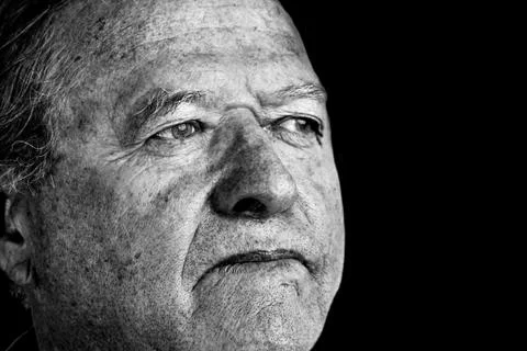 Dramatic portrait of senior man looking away Stock Photos