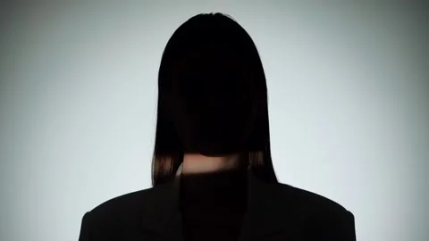Dramatic Portrait of Woman in Shadow and Light Beam Stock Footage 310497789