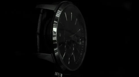 Dramatic profile of a black Wrist Watch against black background 動画素材 68191613