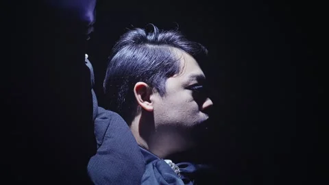 Dramatic Profile of a Man in Low Light Stock Footage 296680939