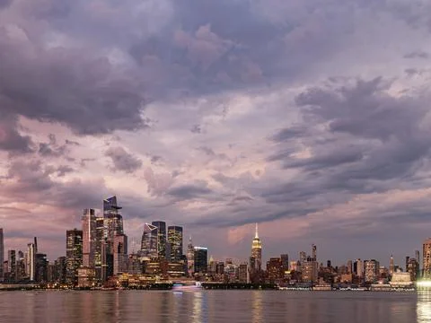 Dramatic Purple Sky after Storm, Midtown New York City at Sunset Stock Photos