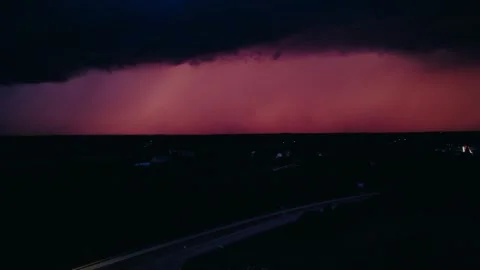 Dramatic purple storm clouds rolling across dark evening sky with moody Video stock 318076414