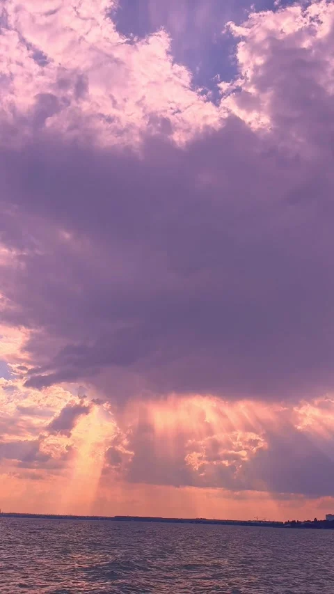 Dramatic Purple Storm Clouds Rolling Over Calm Sea Water Stockbeeldmateriaal 345154778
