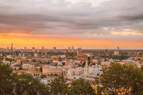 Dramatic purple sunset with orange clouds Stock Photos