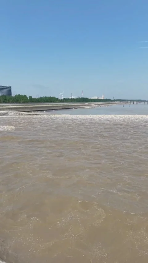 Dramatic Qiantang River Tidal Bore Rushing Through Zhejiang, China Stock Footage 337598410