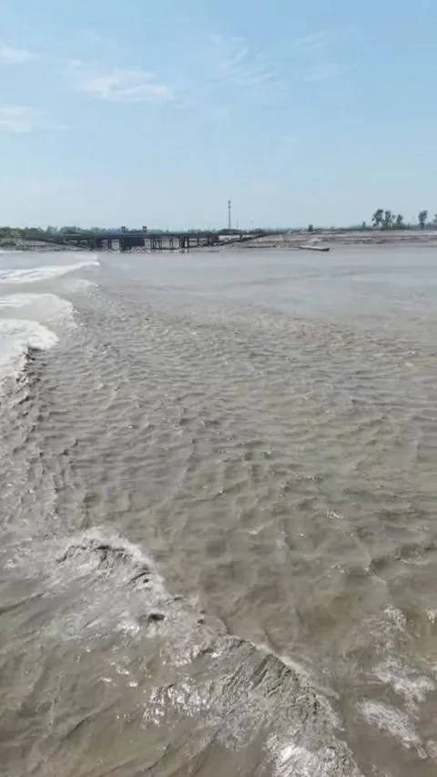Dramatic Qiantang Tidal Bore Creating Powerful Waves in Zhejiang, China Stock Footage 337598446