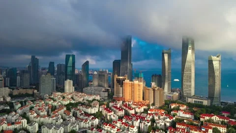 Dramatic Qingdao City Skyline Time-lapse with Coastal View and Moving Clouds Stock Footage 330880447