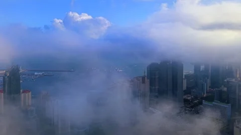 Dramatic Qingdao Cityscape in Rolling Coastal Fog Stock Footage 330947698