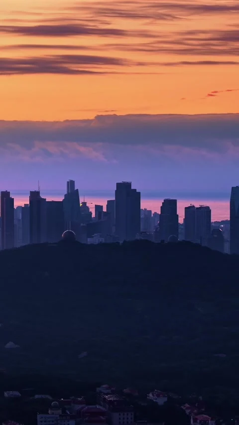 Dramatic Qingdao Cityscape at Vibrant Dawn Stock Footage 330742394
