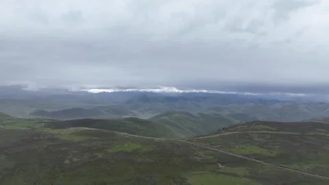 Dramatic Rain Clouds Above Open Highlands in Sichuan, China Stock Footage 344035235
