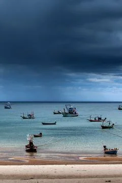 Dramatic rainstorm over a bay. Stock Photos