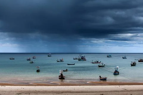 Dramatic rainstorm over a bay. Stock Photos