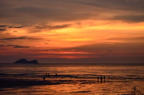 Dramatic Red and Orange Afterglow Sunset at Sea. Stock Photos