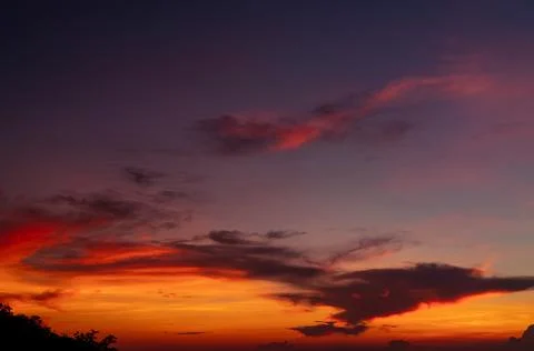 Dramatic red and orange sky and clouds abstract background. Red-orange clouds Stock-Fotos