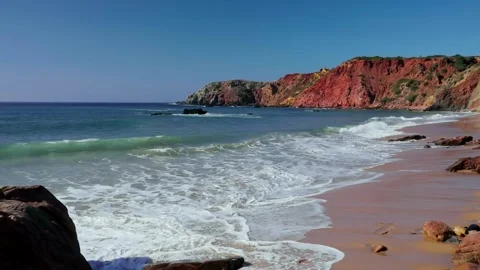 Dramatic Red Cliffs at Western Coast Beach Portugal Stock Footage 306661036