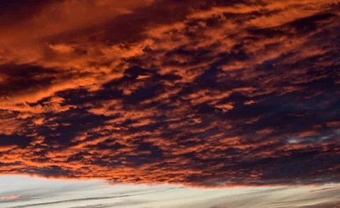 Dramatic Red clouds for pattern background. A burning sky in a horror movie.  Stock Photos