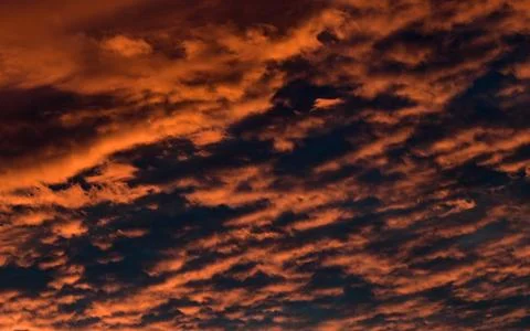 Dramatic Red clouds for pattern background. A burning sky in a horror movie.  Stock Photos