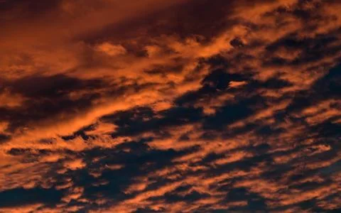 Dramatic Red clouds for pattern background. A burning sky in a horror movie.  Stockfoto's