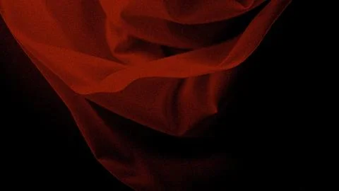 Dramatic red fabric draped elegantly against dark background Illustrazione stock
