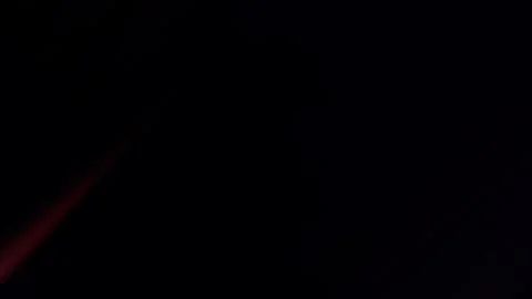 Dramatic red light streak illuminating dark night sky evoking mystery and Stock Illustration