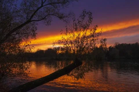 Dramatic red orange sunset, Kiessee Goettingen in Germany Stock Photos